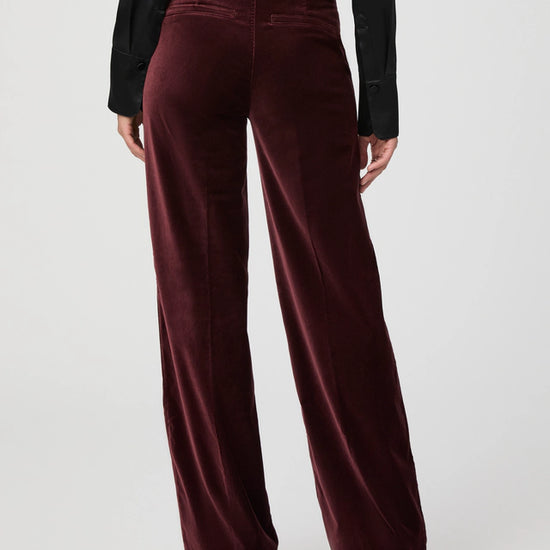 Rear view of dark velvet trousers