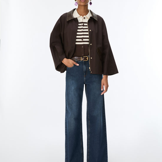 woman wearing brown jeans and brown jacket 