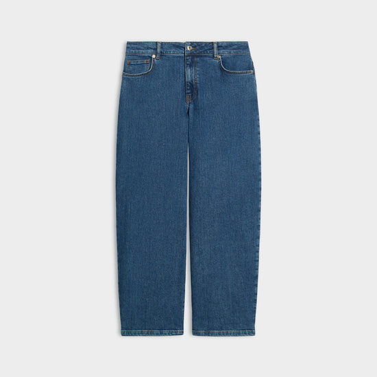 A pair of medium wash blue denim jeans shown flat against a light gray background.