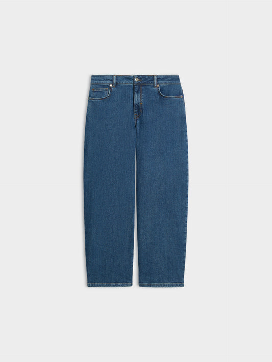 A pair of medium wash blue denim jeans shown flat against a light gray background.