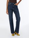 woman wearing blue jeans and brown top