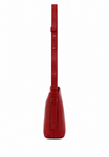 A red textured leather shoulder bag shown from the back, featuring a long matching strap and a vertical strap detail on the back panel, set against a plain white background.