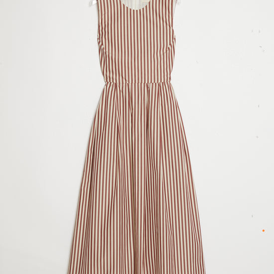 Striped dress hanging on a white background