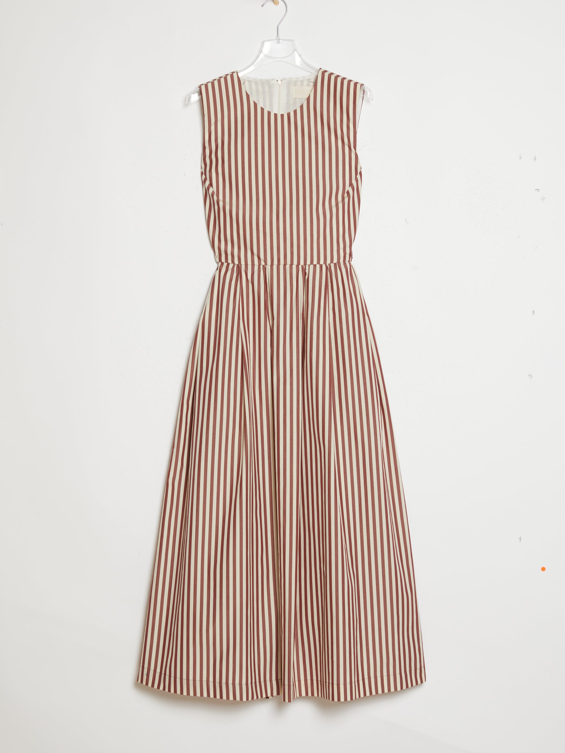 Striped dress hanging on a white background