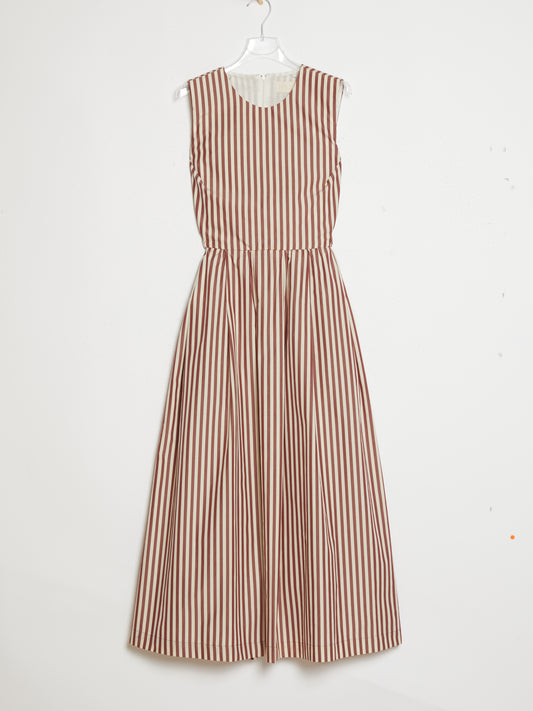 Striped dress hanging on a white background