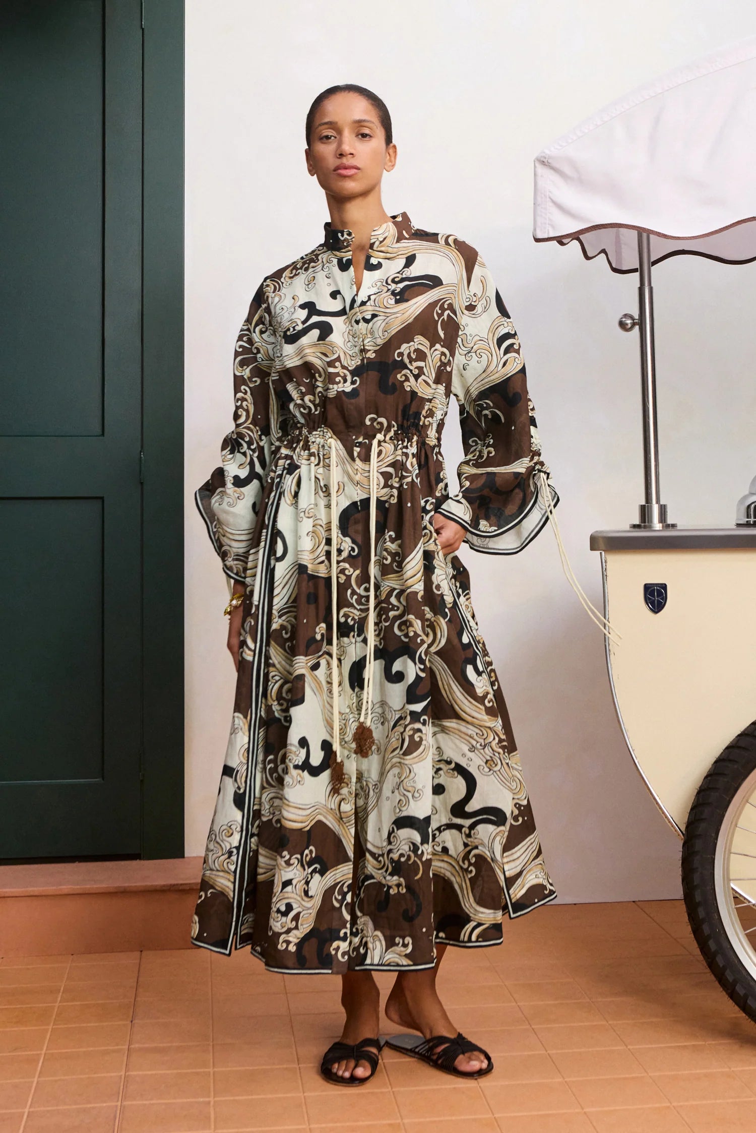 model wearing brown pattern shirtdress