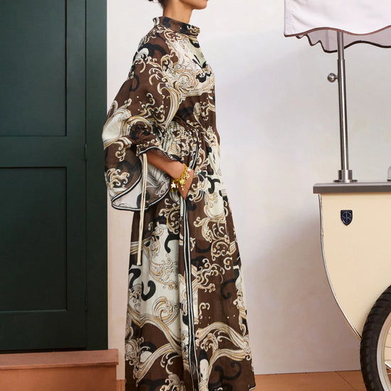 side profile of model wearing brown shirtdress