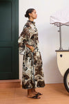 side profile of model wearing brown shirtdress