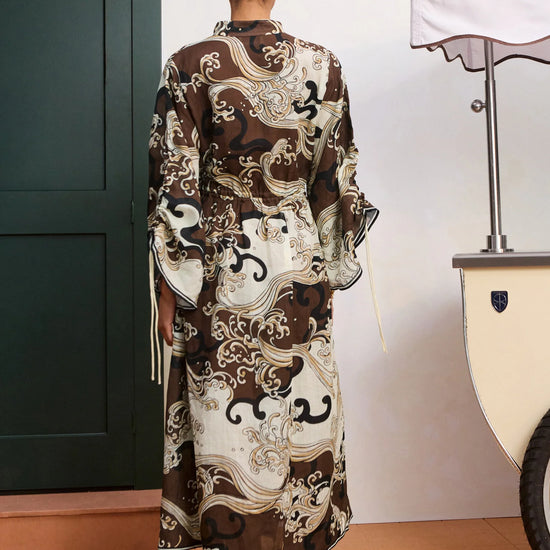 rear view of brown pattern shirtdress