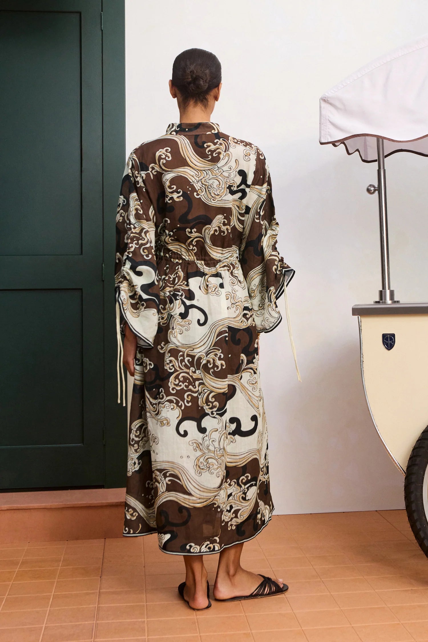 rear view of brown pattern shirtdress