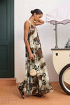 Side profile of model wearing brown midi dress