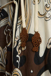 close up of brown pattern on dress