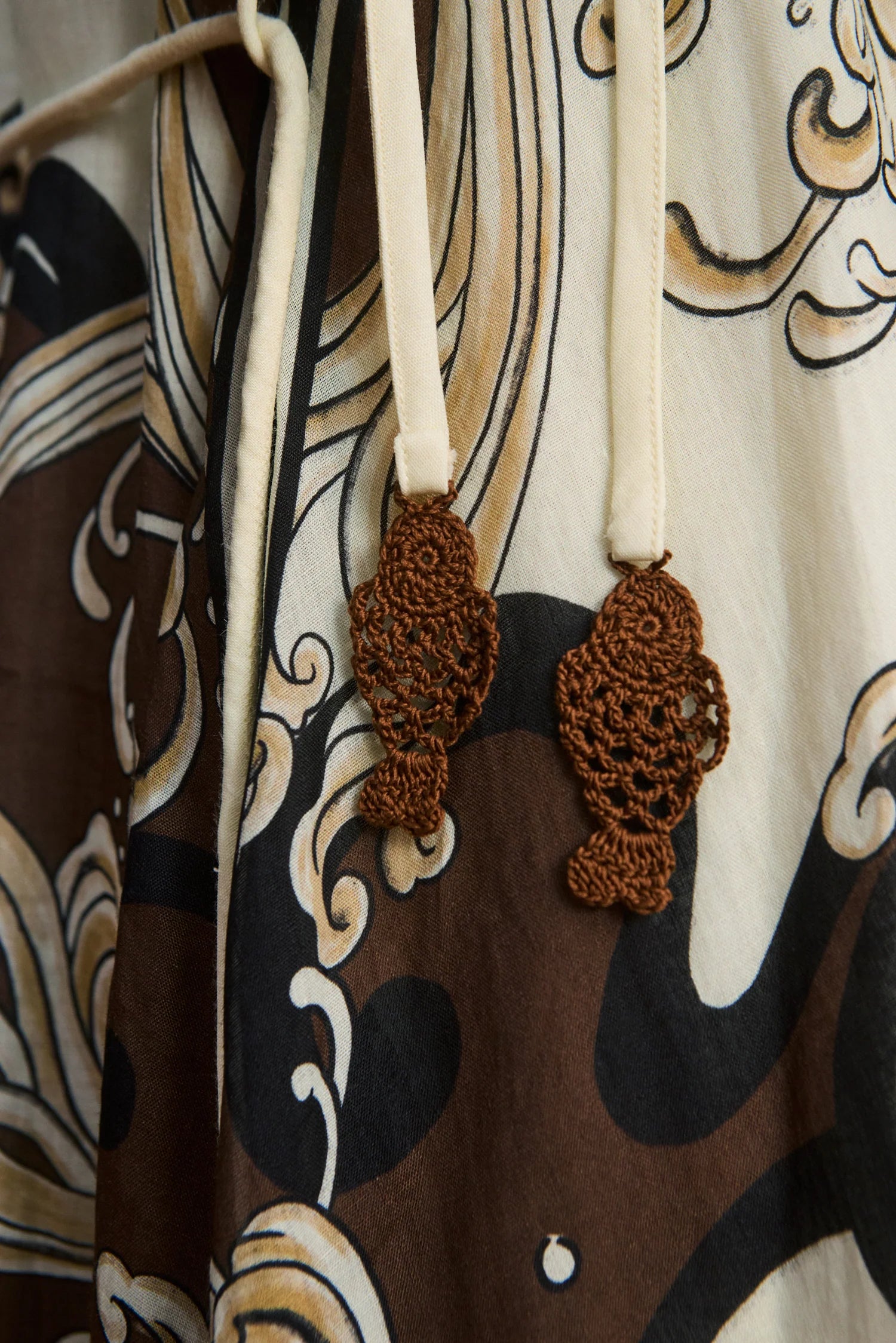 close up of brown pattern on dress