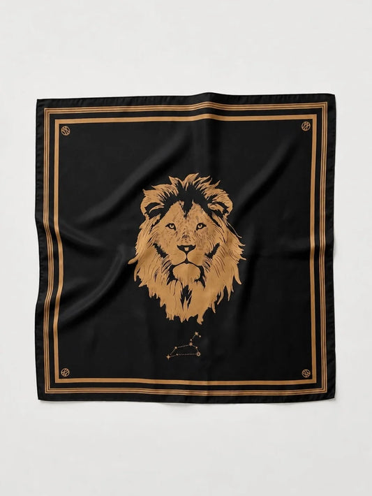A square black scarf featuring a large gold lion head illustration in the center, bordered by double gold stripes and small gold decorative motifs in the corners, laid flat against a light gray background.