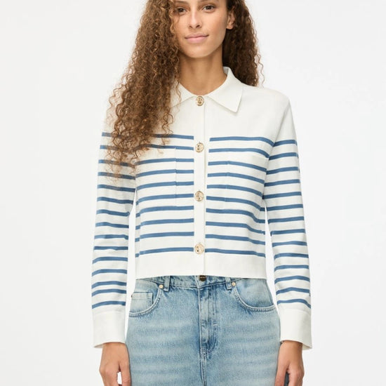 white long sleeve collar cardigan with blue horizontal stripes and gold buttons model