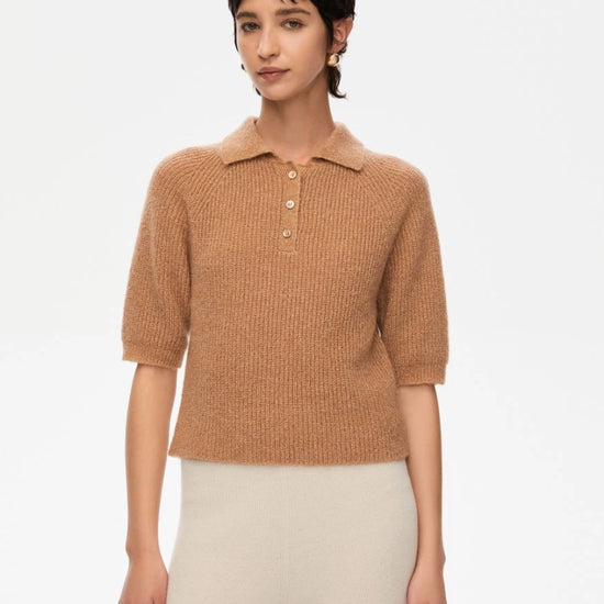 short sleeve knitted polo style shirt with 3 buttons and a slight shimmer from iblues model shot