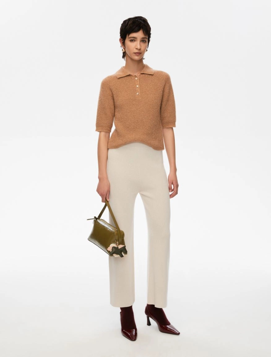 short sleeve knitted polo style shirt with 3 buttons and a slight shimmer from iblues model shot