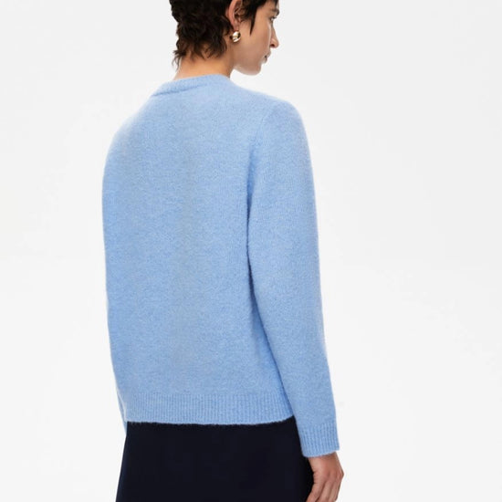 round neck ribbed relaxed blue jumper with lettering on the front in a contrasting dark blue from iblues rear view