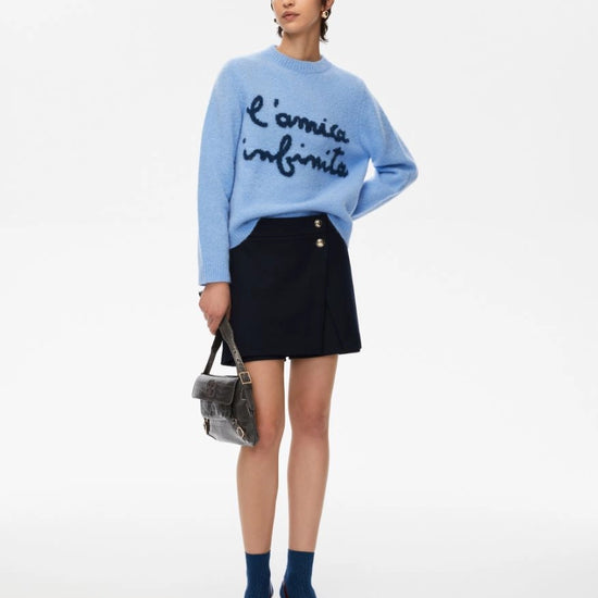 round neck ribbed relaxed blue jumper with lettering on the front in a contrasting dark blue from iblues model shot 