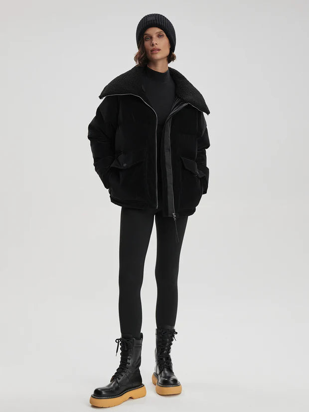 black oversized puffer with sherpa collar and 2 front flap pockets model shot