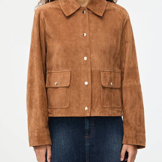 Brown suede jacket worn by a person on a white background