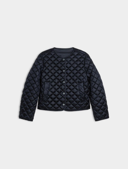 navy quilted coat on white background