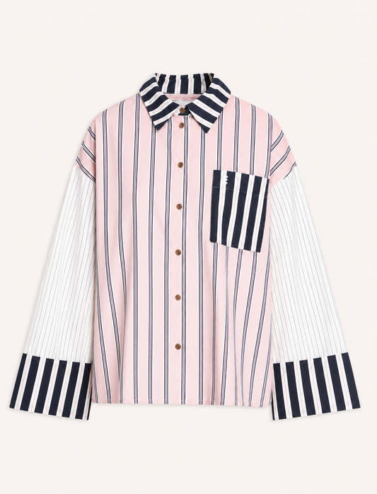A long-sleeve button-up shirt with a pink and white vertical stripe body, contrasting black and white striped collar, chest pocket, and cuffs, displayed on a light cream background.