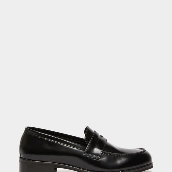 black leather loafers with small heel and metallic dot detailing along the edging form iblues