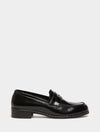 black leather loafers with small heel and metallic dot detailing along the edging form iblues
