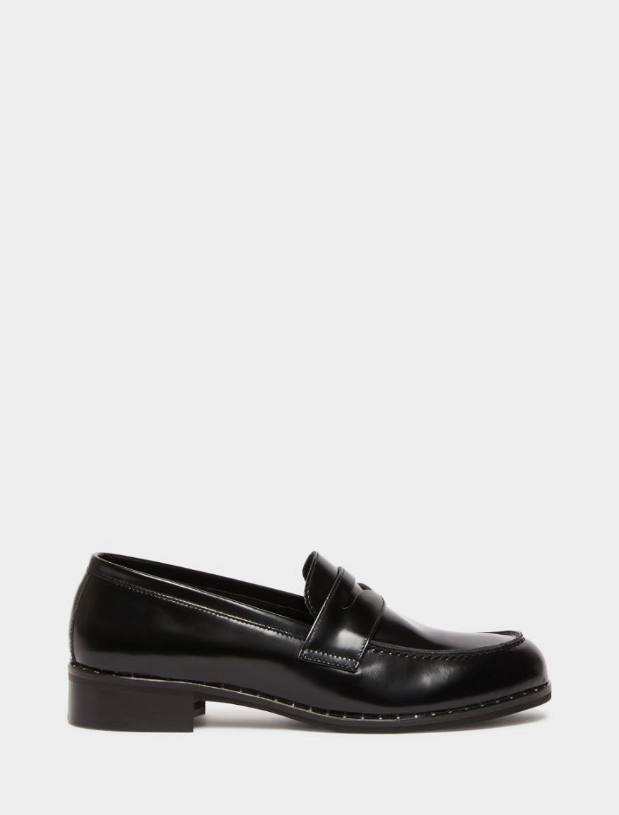 black leather loafers with small heel and metallic dot detailing along the edging form iblues