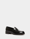 black leather loafers with small heel and metallic dot detailing along the edging form iblues front view