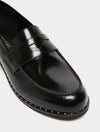 black leather loafers with small heel and metallic dot detailing along the edging form iblues front view close up