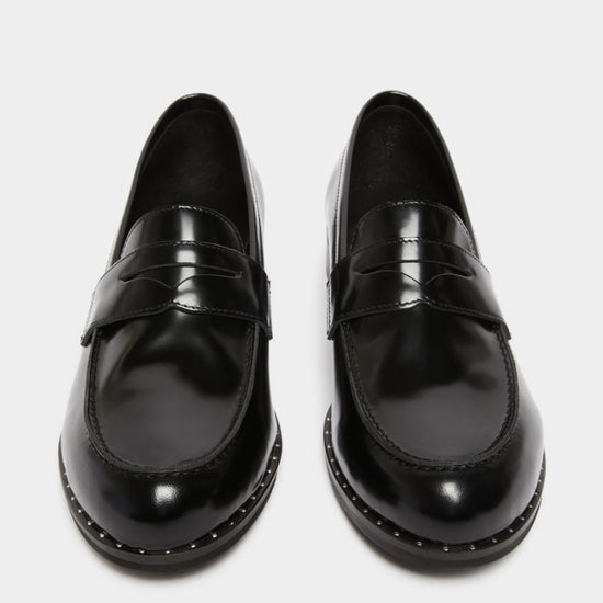 black leather loafers with small heel and metallic dot detailing along the edging form iblues front view