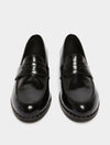 black leather loafers with small heel and metallic dot detailing along the edging form iblues front view