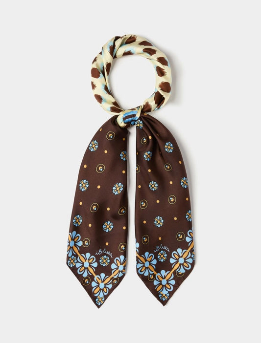 Brown floral patterned scarf with a white and brown checkered knot on a light gray background