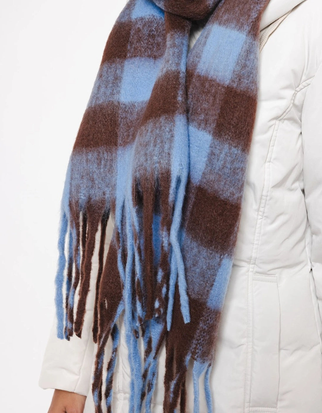 blue and brown check scarf with fringe detail close up