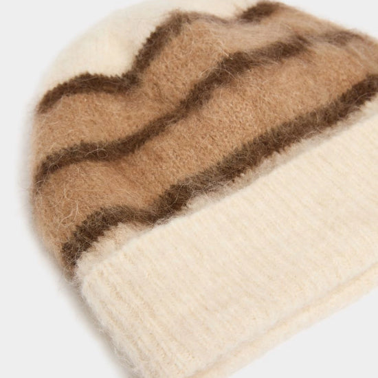 brown and cream stripe beanie on white background close up 