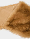 A close-up of a tan faux fur trim or collar with a smooth beige lining, shown against a plain white background.
