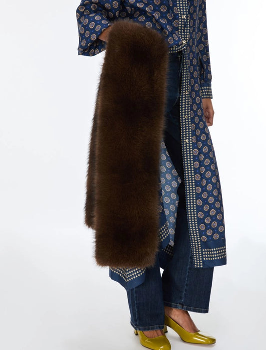model holding chocolate brown faux fur scarf