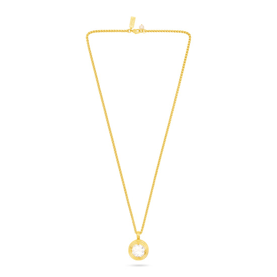 A delicate yellow gold chain necklace with a small circular pendant featuring a clear round gemstone, displayed against a solid white background.