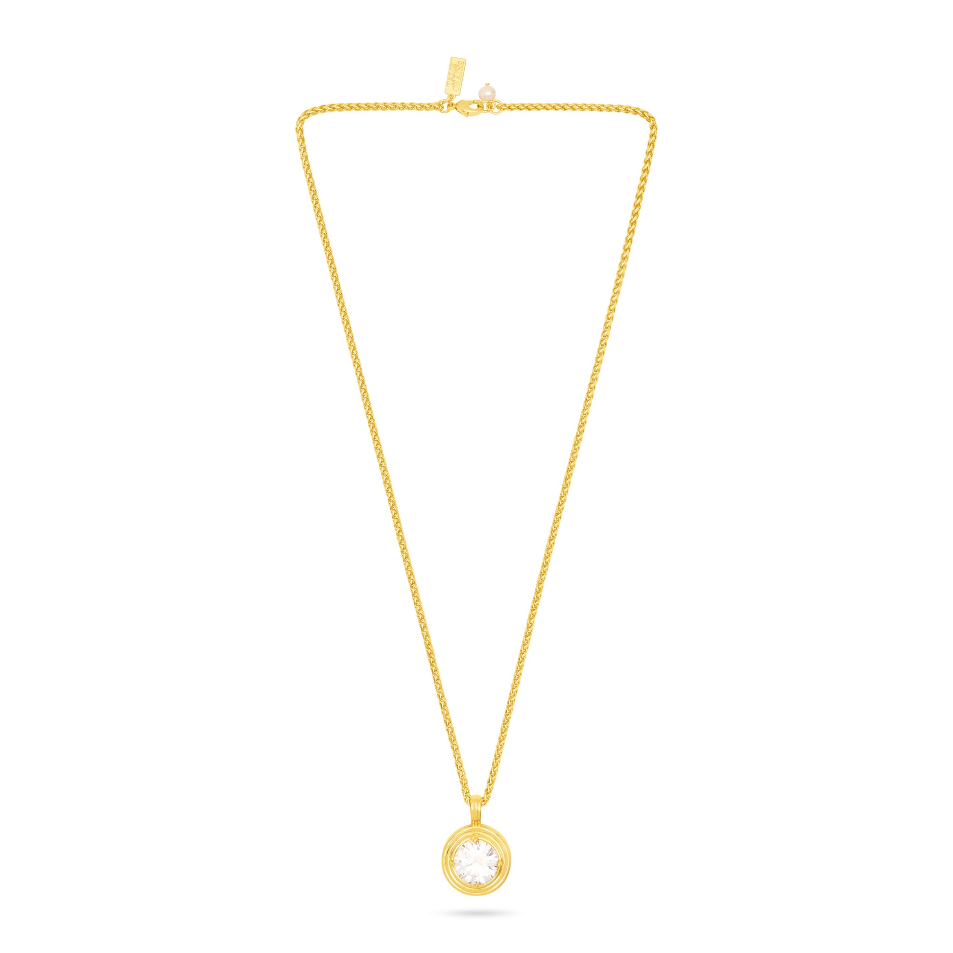 A delicate yellow gold chain necklace with a small circular pendant featuring a clear round gemstone, displayed against a solid white background.