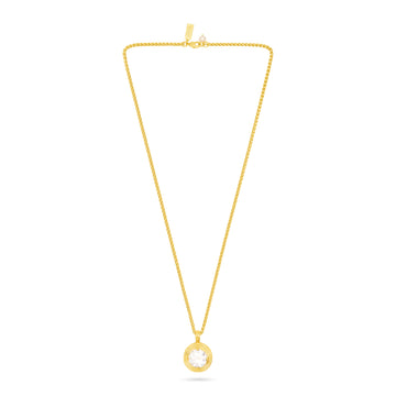 A delicate yellow gold chain necklace with a small circular pendant featuring a clear round gemstone, displayed against a solid white background.