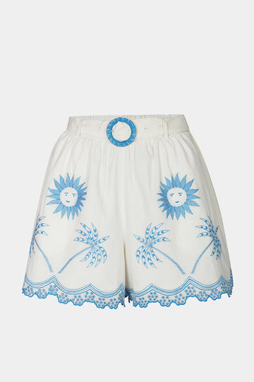 White shorts with blue sun and palm tree patterns on a white background