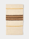 brown and cream stripe scarf on white background