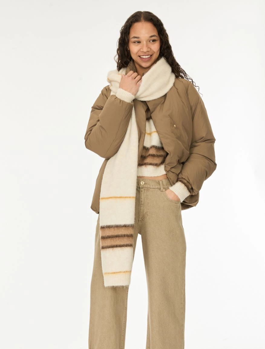 woman wearing brown and cream stripe scarf