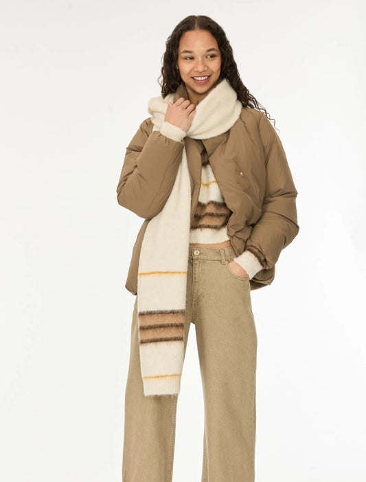 woman wearing brown and cream stripe scarf