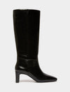 Black high leather boot on white background