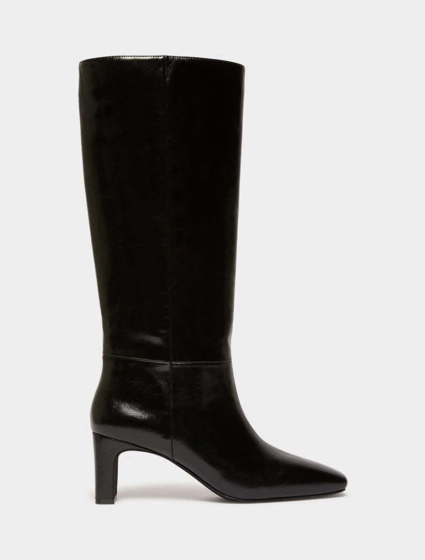 Black high leather boot on white background