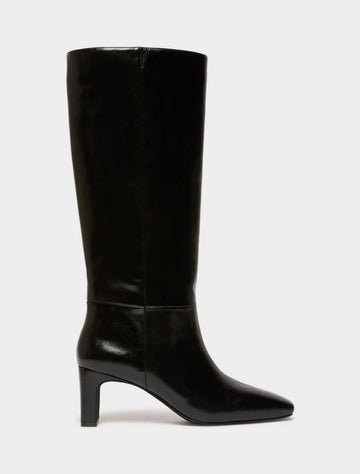 Black high leather boot on white background