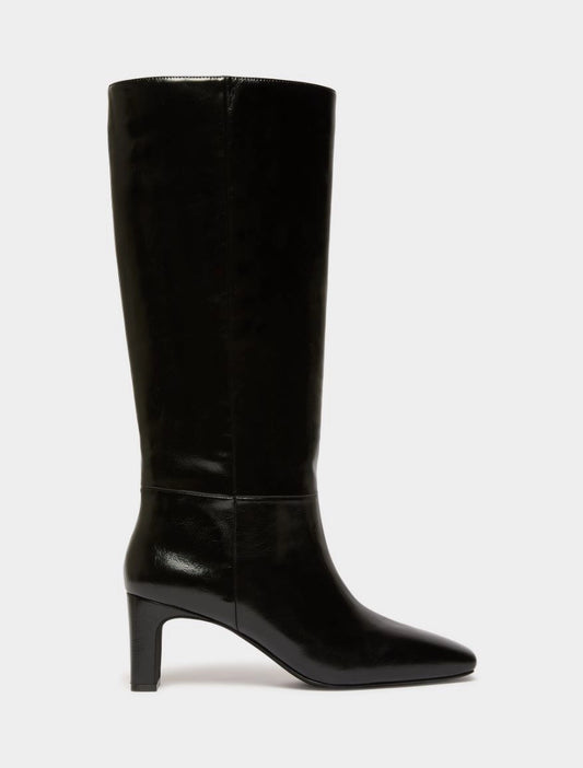 Black high leather boot on white background